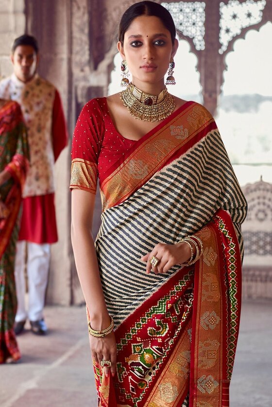 Linen White & Red Patola Silk Saree With Zari Border Pallu & Stone Work