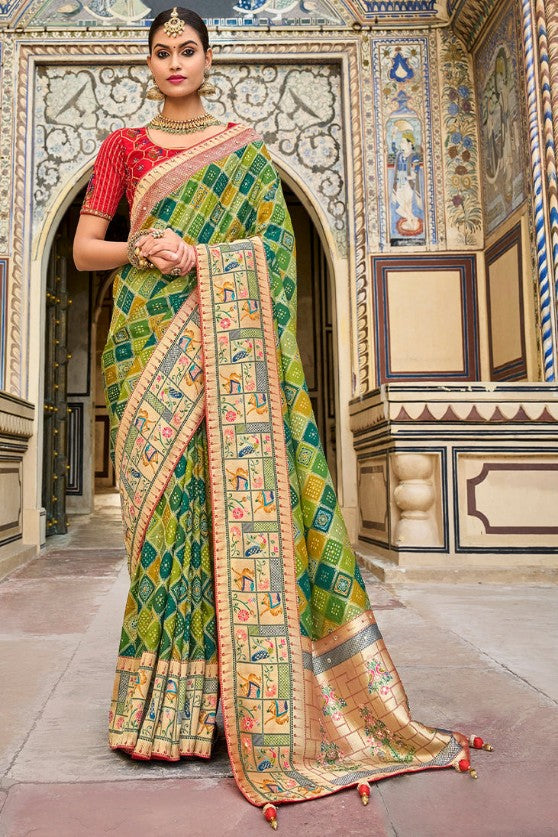 Shades Of Green Woven Patola Silk Saree With Heavy Embroidered Blouse