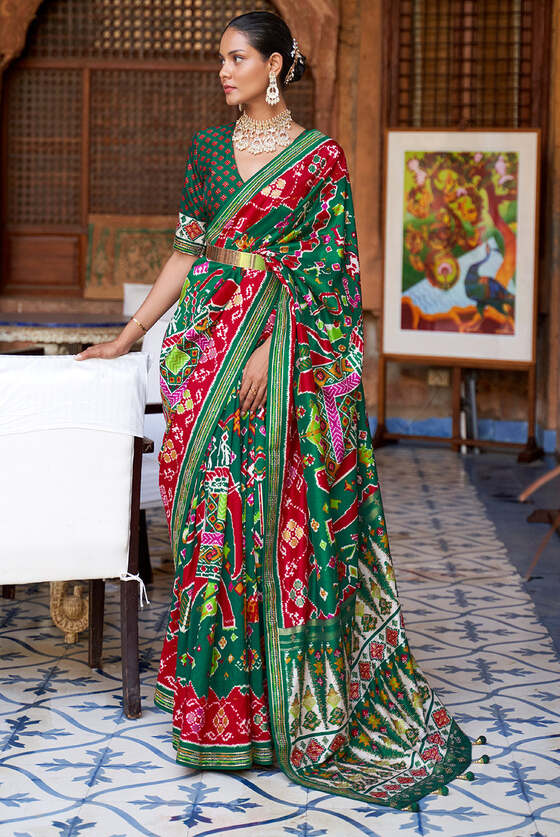 Jungle Green Printed Patola Silk Saree With Zari Border & Tassels On Pallu