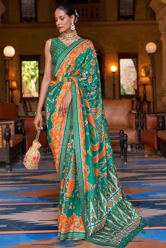 Green & Orange Printed Patola Silk Saree With Zari Border & Tassels On Pallu