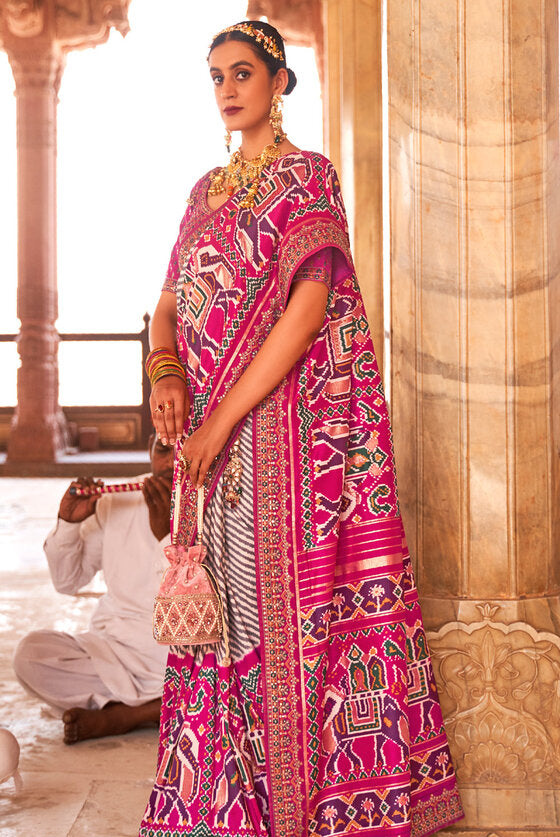 Subtle Pink Woven Patola Silk Saree With Heavy Border