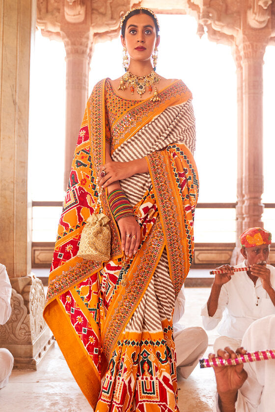 Bright Yellow Woven Patola Silk Saree With Heavy Border