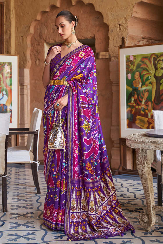 French Purple Printed Patola Silk Saree With Zari Border & Tassels On Pallu