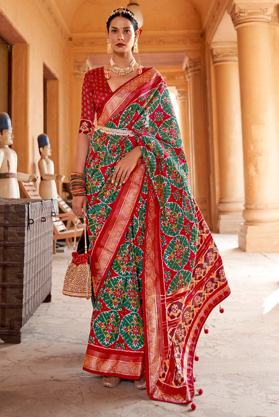 Berry Red And Green Patola Silk Saree With Handmade Tassels