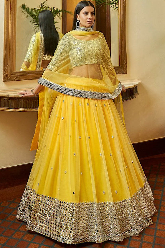 Turmeric Yellow Soft Net Lehenga With Gota & Mirror Work