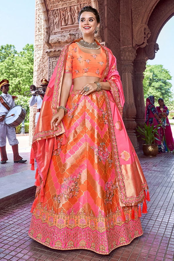 SALMON AND CORAL PINK EMBROIDERED SILK LEHENGA WITH EMBROIDERED BLOUSE AND DUPATTA