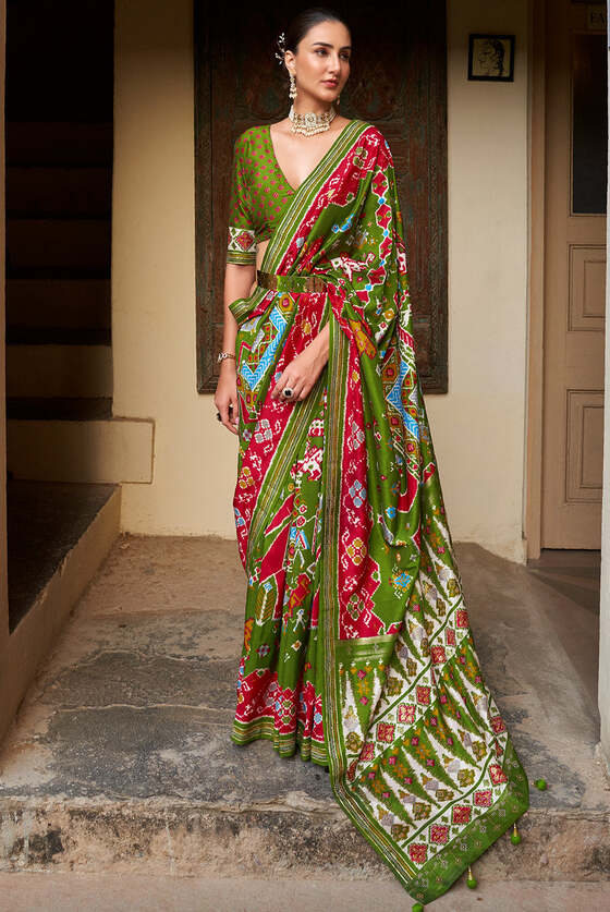 Kelly Green Printed Patola Silk Saree With Zari Border & Tassels On Pallu