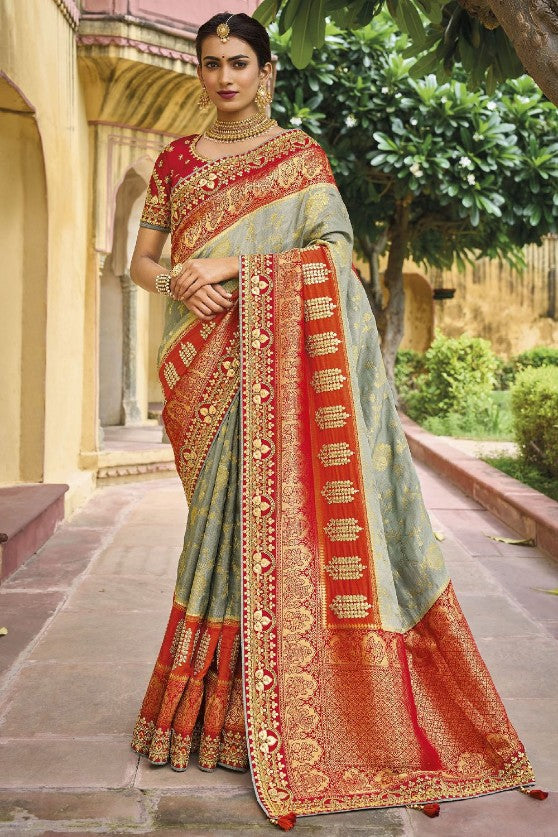 Grey Viscose Silk Traditional Woven Saree

With Embroidered Border And Blouse
