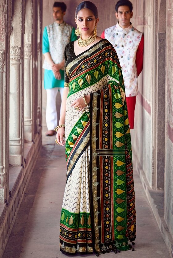 Daisy White & Green Patola Silk Saree With Zari Border Pallu & Stone Work